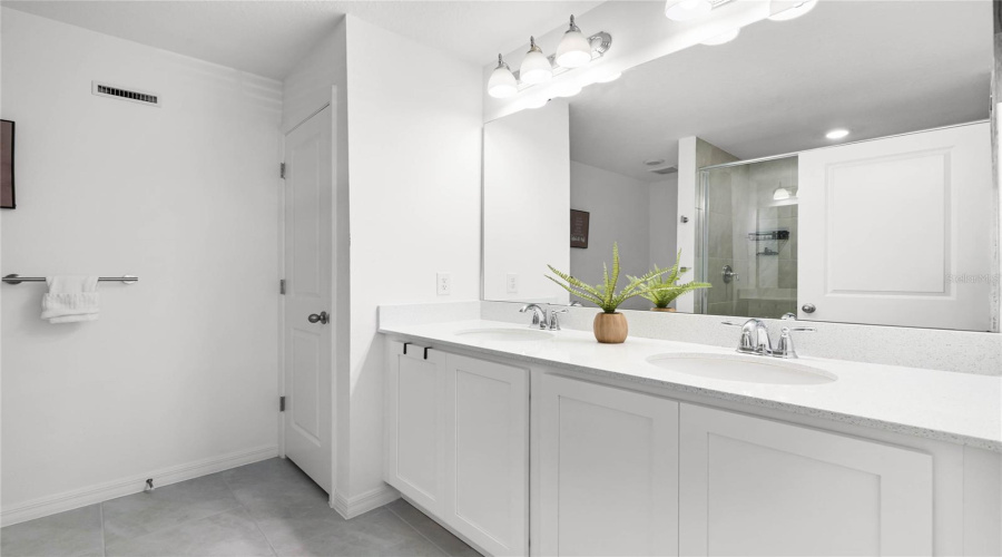 Primary Bedroom En-Suite With Dual Quartz Vanities