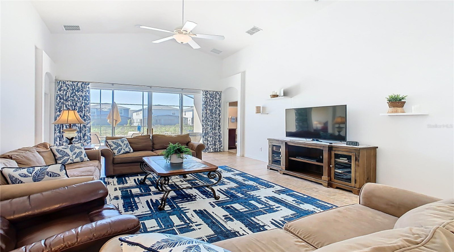 Living Room Is Light And Bright And Has Sliding Doors To Your Private Pool