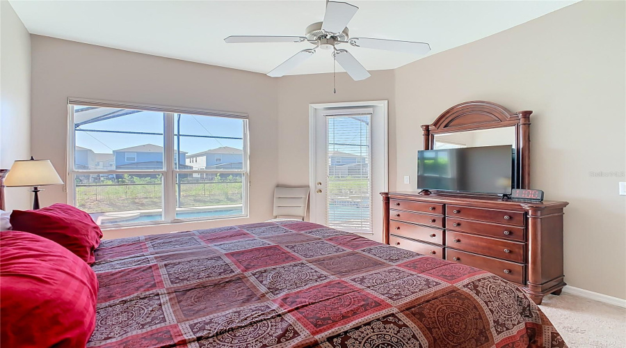 Primary Bedroom Off The Living Room With Access To The Pool And An Ensuite Bath