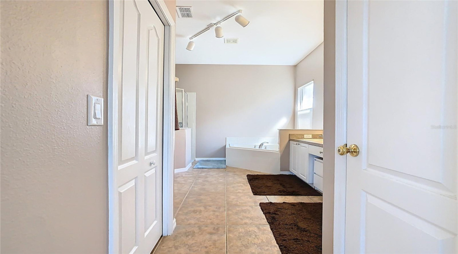 Primary Bathroom With Garden Tub And Separate Shower Stall