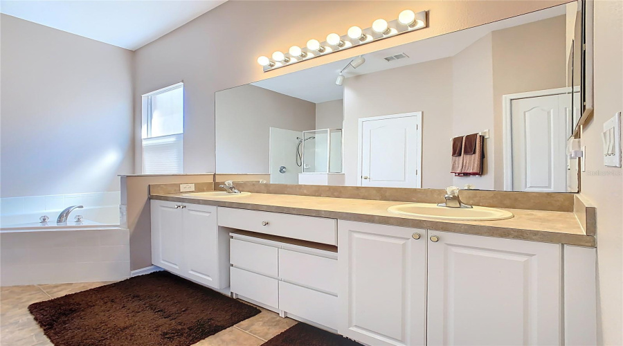 Dual Vanity Sinks And Plenty Of Cabinet Space For Storage