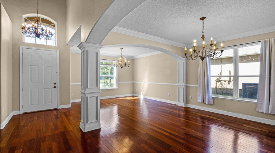 View of the foyer, formal living room, and formal dining room