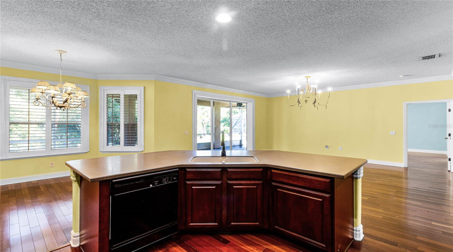 Kitchen looking into the family room and breakfast nook