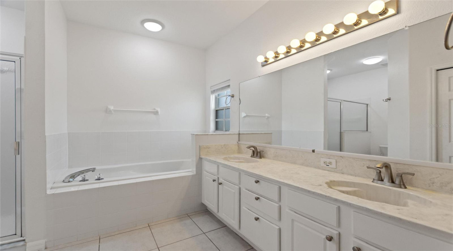 Primary bathroom with linen & walk in closets
