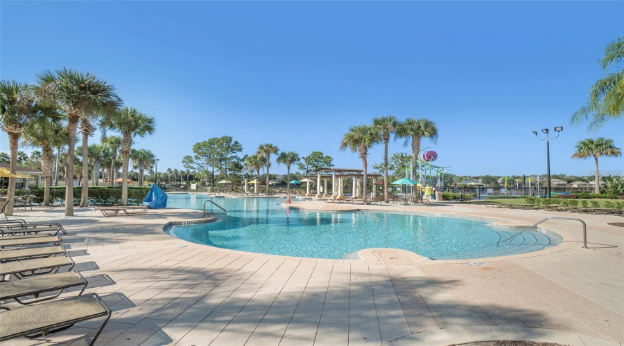 Lovely Pool At Clubhouse With Multiple Entrances To The Sparkling Water!
