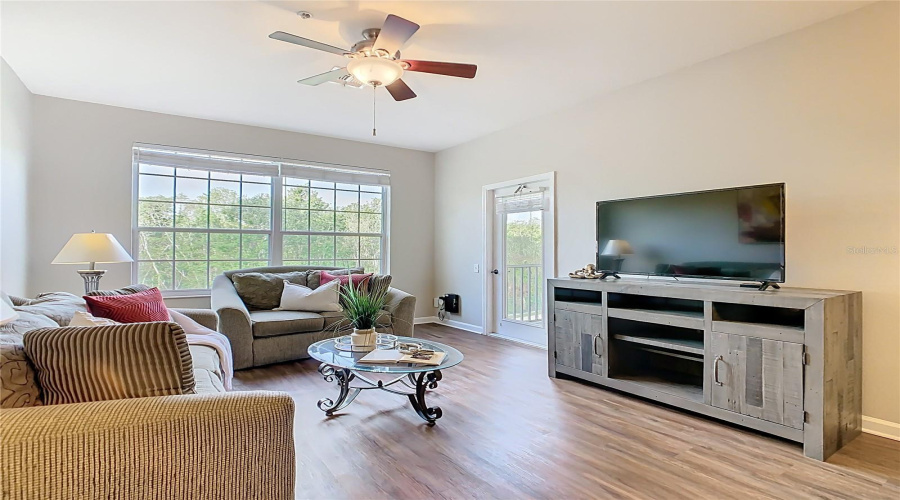 Living Room – Bright open layout with new flooring.