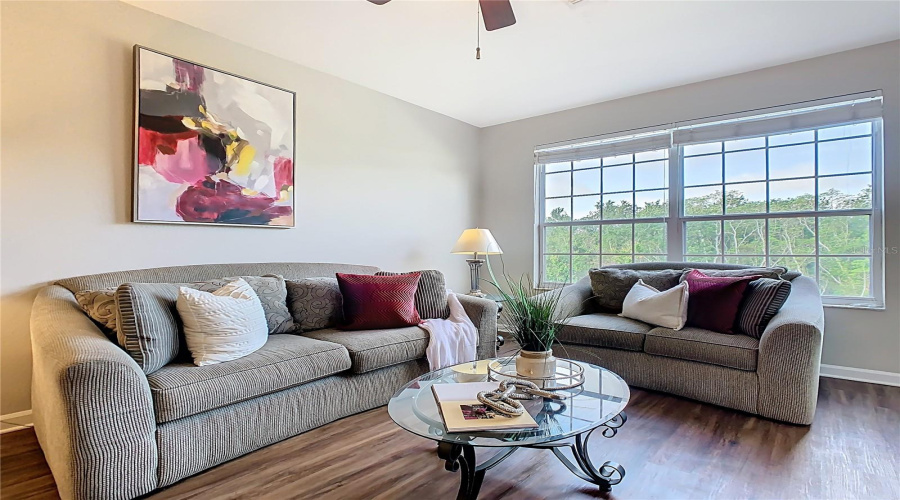 Living Room – Bright open layout with new flooring.