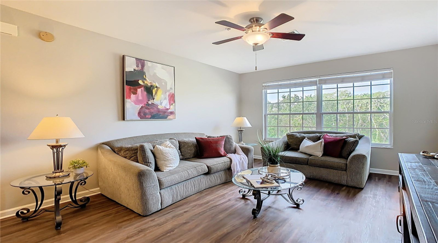 Bright and welcoming with open layout and brand-new luxury vinyl flooring.
