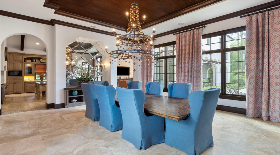 Formal dining room with fireplance and attached wet bar access