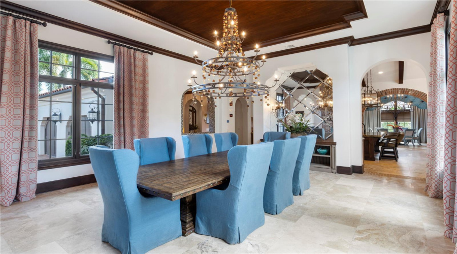 Formal dining room with fireplance and attached wet bar access