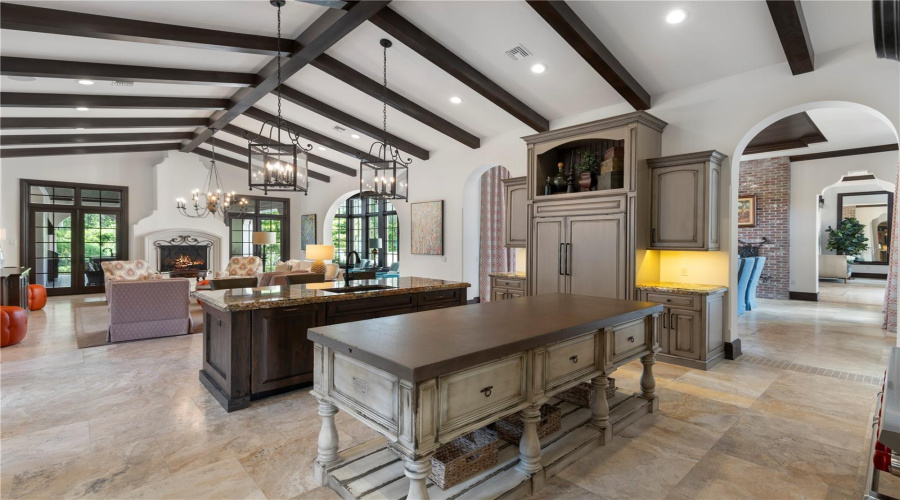 Chef's kitchen with double island overlooking living room