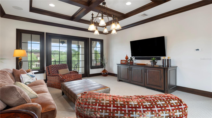 Second floor multipurpose room, separating guest suites, with balcony access on the front and back of home