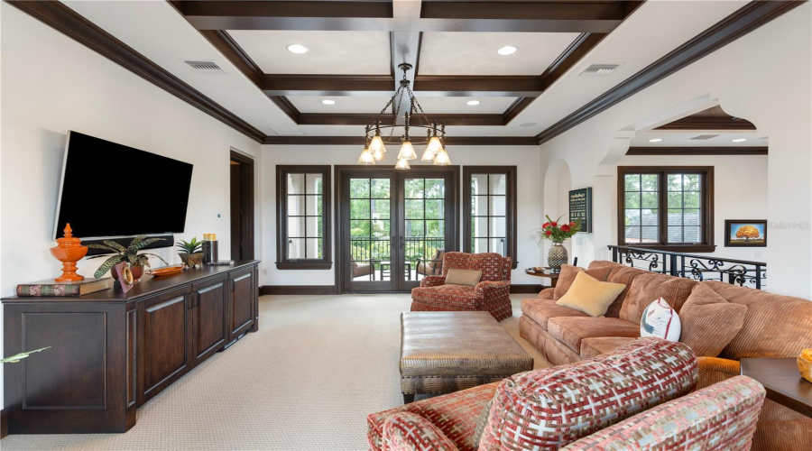 Second floor multipurpose room, separating guest suites, with balcony access on the front and back of home