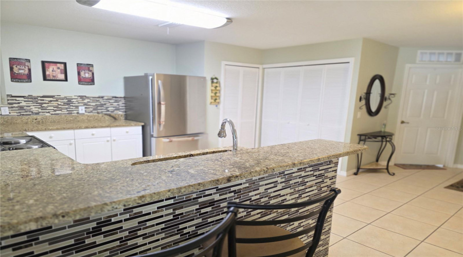 The laundry closet is in the kitchen with full size washer and dryer.