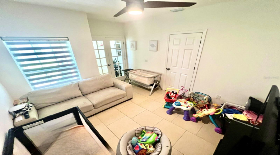 Downstairs den with French doors (office, game room or 5th bedroom) It has a closet.