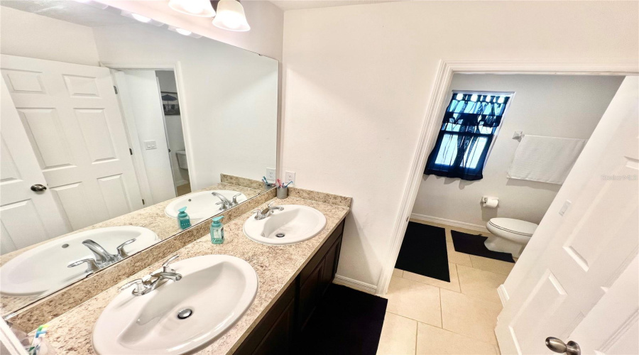 Bathroom with separate shower on the second floor.