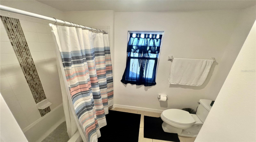 Bathroom with separate shower on the second floor.