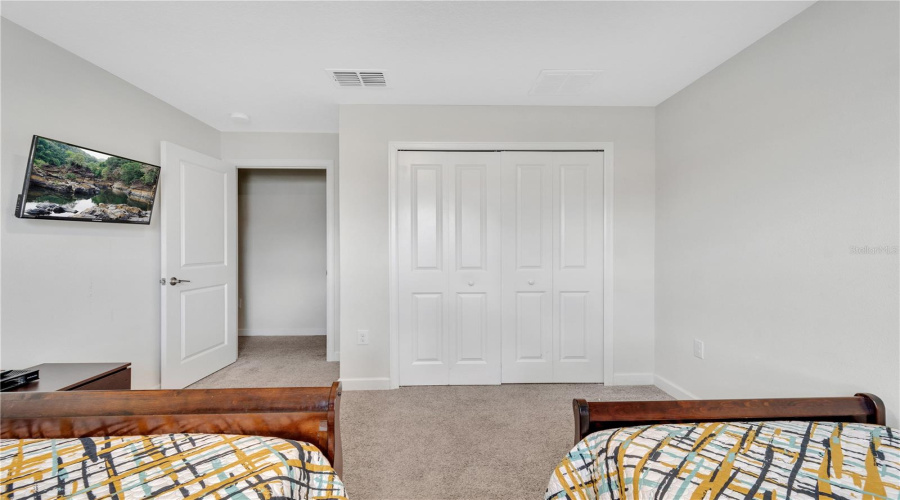 Bedroom 3 displaying closet and TV