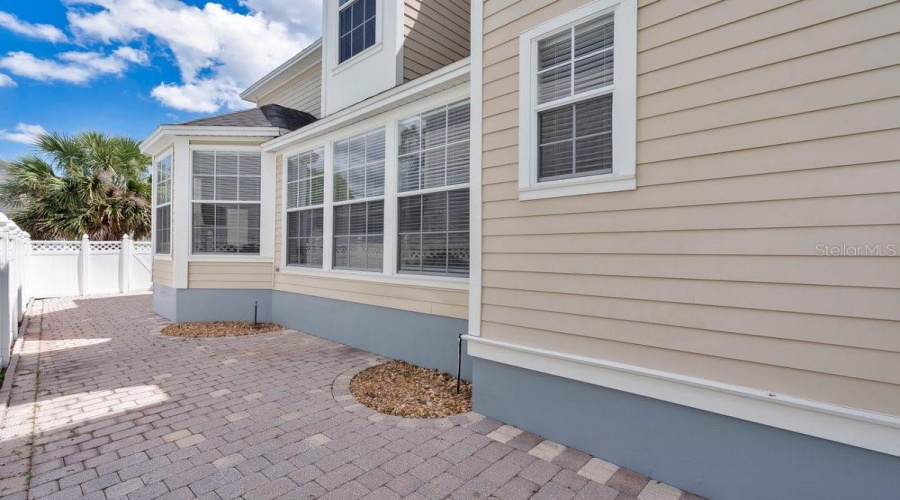 Paver Backyard With Vinyl Fence