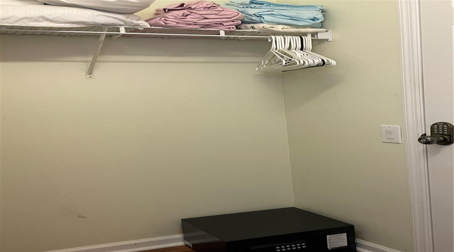 Primary Closet w/ owners locked closet.