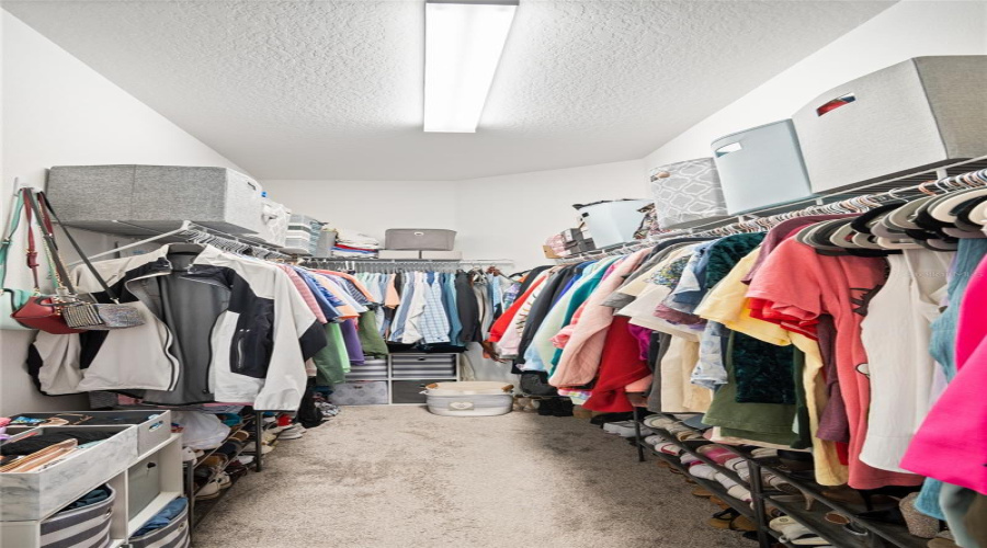 The Walk-In Closet In The Primary Bedroom.