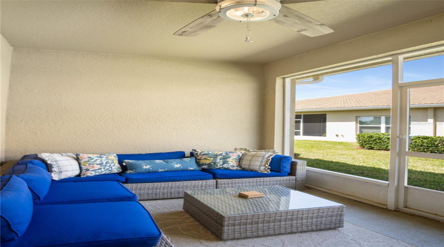 A Place To Enjoy The Outdoors While Screened And Covered.  Stay Cool With The Ceiling Fan.