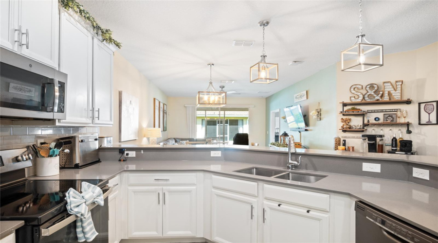 Light And Bright With The Lighting And Sliding Glass Door That Brings In The Natural Light.