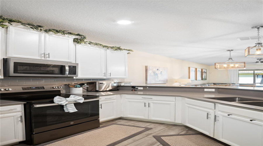 Another View Of The Kitchen Showing Plenty Of Cabinets For Storage.