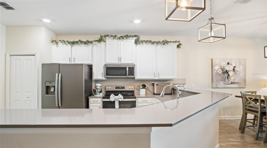 A Breakfast Bar Provides Additional Room For Eating Or Just Gathering Around When Entertaining.