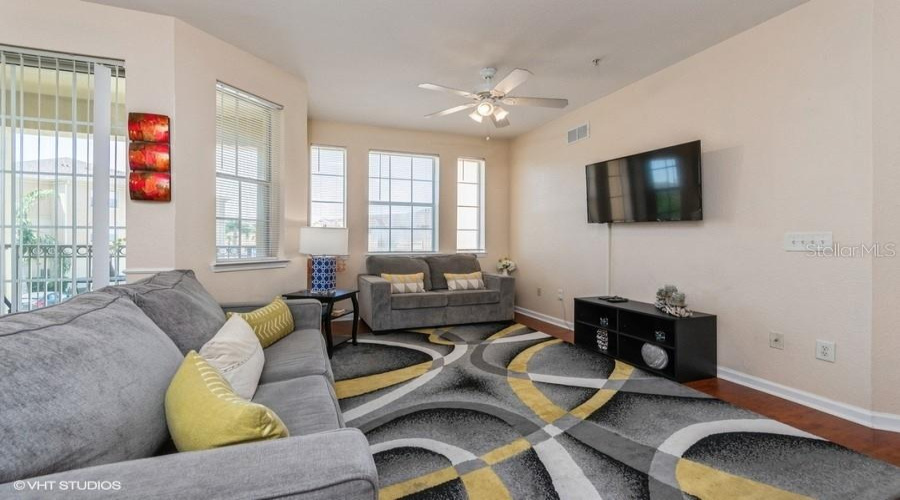 Bright And Welcoming, The Living Room Offers A Seamless Flow To The Rear Porch Through Convenient Sliding Doors.
