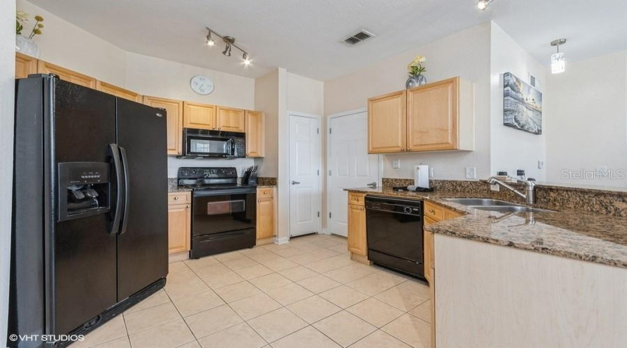 Featuring Ample Cabinet Space, A Pantry Closet And Polished Granite Counters, The Kitchen Is Perfectly Designed For Both Everyday Cooking And Entertaining.