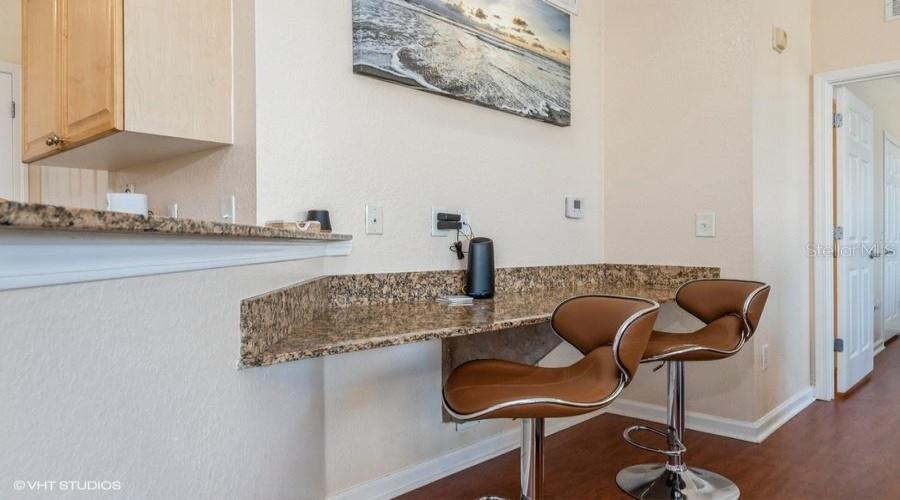 A Built-In Granite Counter Space Is Perfect For Casual Dining Or A Home Workspace.