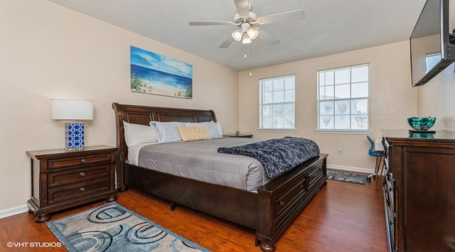 Generously Sized And Filled With Natural Light From Two Windows, The Primary Bedroom Also Includes A Ceiling Fan For Added Year-Round Comfort.