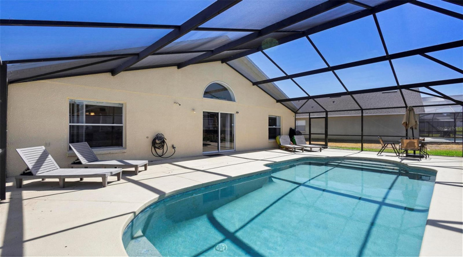 Relax & Unwind In The Screened-In Pool