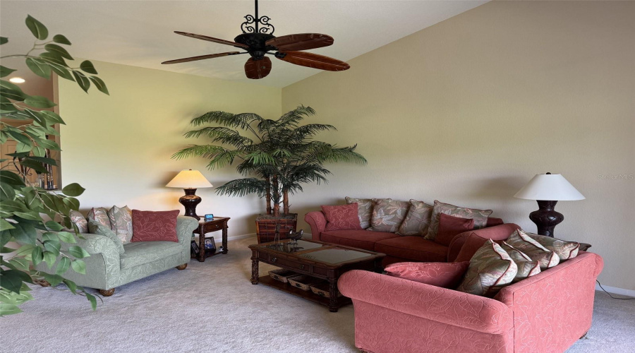 The Living Room Is Large And Filled With Light From The Balcony