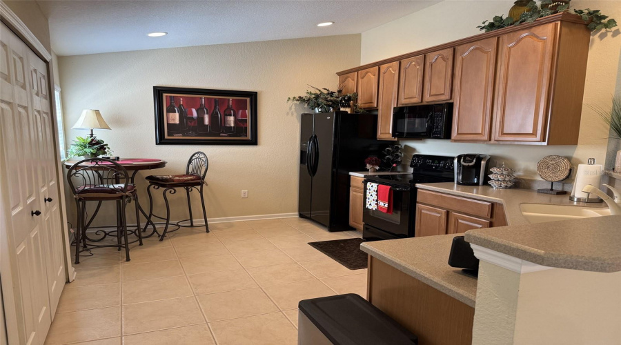 The Kitchen Features Plenty Of Cabinets