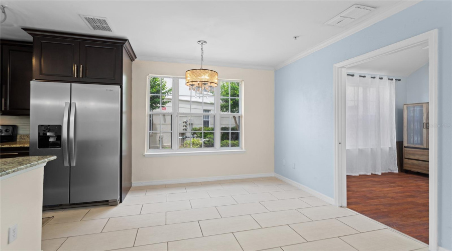 Dining Area With View Of Entry To Home Office/Guest Room On The Right.