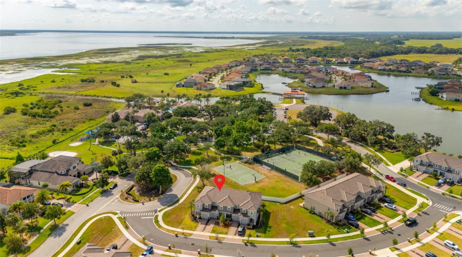 Next to Clubhouse pool, tennis courts, basketball courts and lake dock.