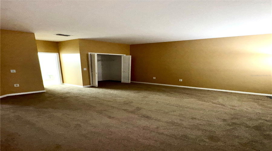 Primary Master bedroom looking towards ensuite bathroom.