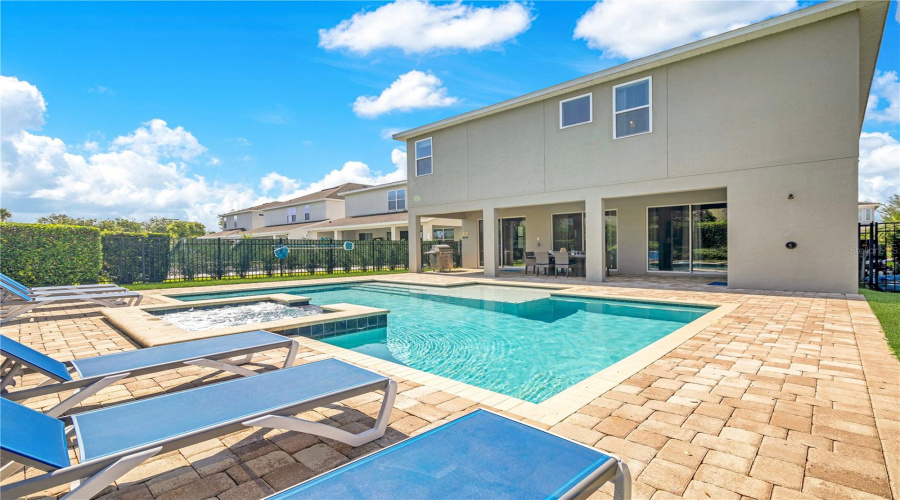 Large Pool Deck With Plenty Of Outdoor Seating