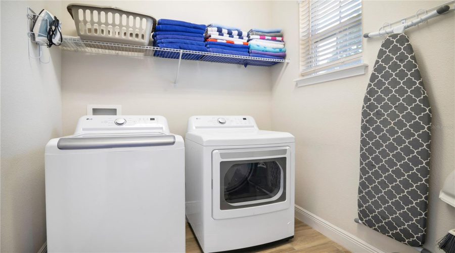 Downstairs Laundry Room With New Washer And Dryer