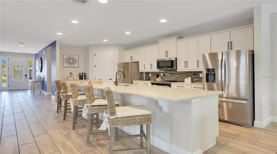 Two Stainless Steel Refrigerators And Two Dishwashers Make Entertaining A Breeze