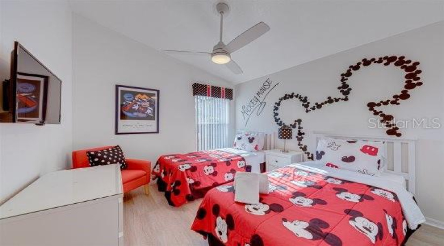Mickey Themed Twin Bedroom With Pool View And Built In Closet