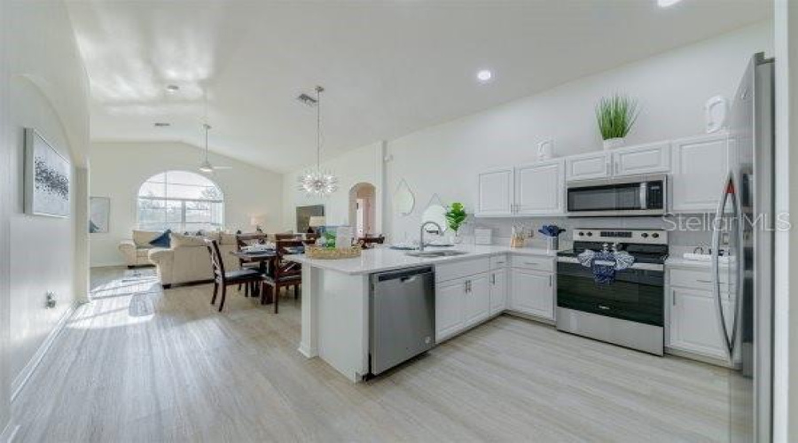 Beautiful Renovated Kitchen With Sparkle Quartz Countertops, Refurbished Solid Wood Cabinets, Stainless Steel Stink And Appliances All Replaced In 2022.