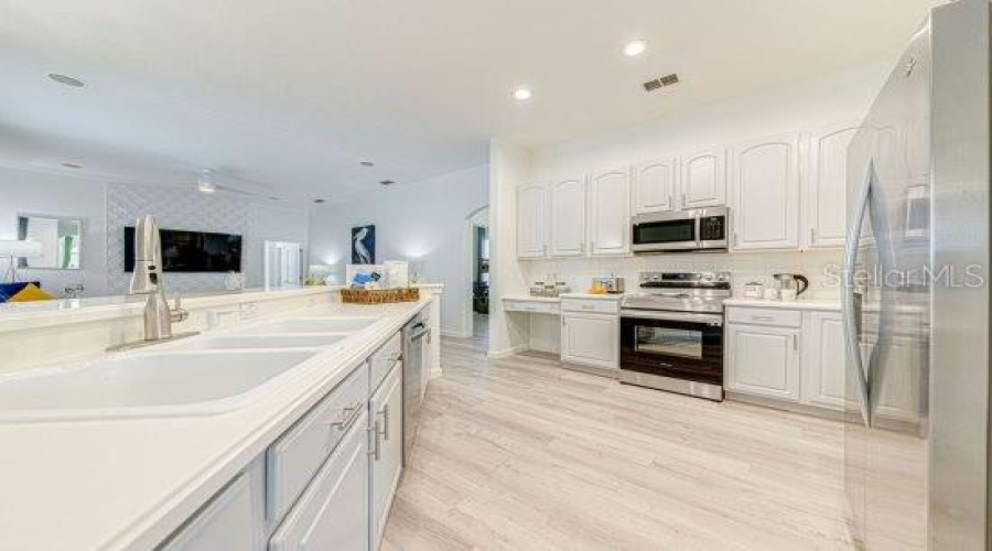 Refurbished Kitchen Cabinets Complimented With 2022 Stainless Steel Appliances