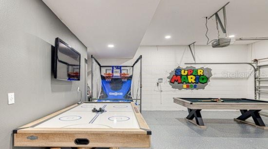 2 Part Epoxy Flooring For Great Wear, Upgraded Led Garage Ceiling Light With Flat Screen Tv And Professionally Painted Wall Art