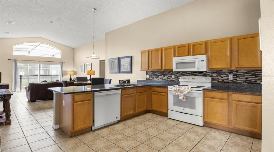 Kitchen with backsplash looking towards the living room