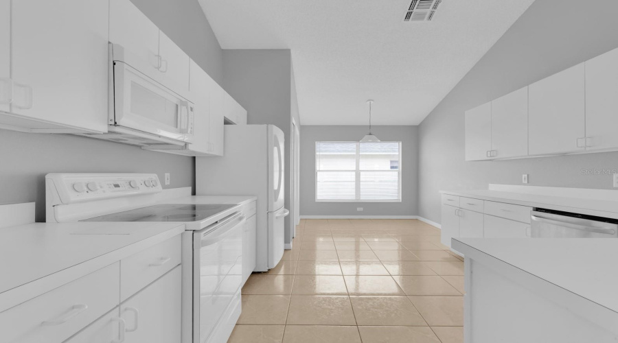 Kitchen with inside laundry room and pantry closet