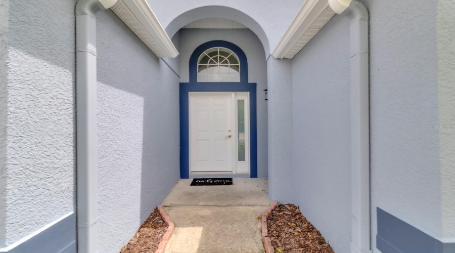 Covered entrance and rain gutters