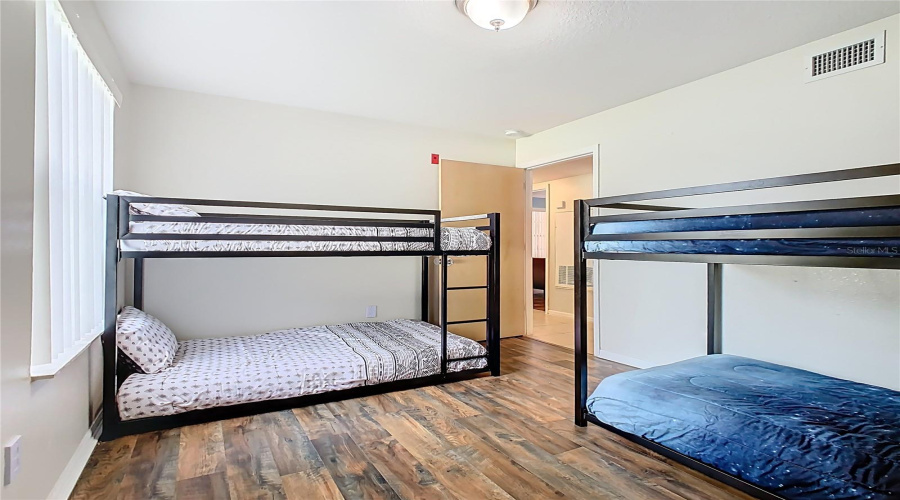 Spacious 4th bedroom, two sets of twin bunkbeds and ample floorspace.